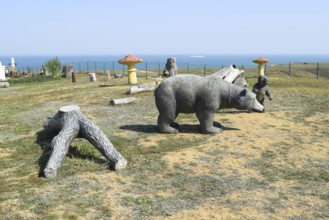 Mannequin dummy bear on the lawn. Taman, Krasnodar Krai, Russia