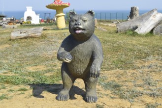 Mannequin dummy bear on the lawn. Taman, Krasnodar Krai, Russia