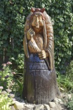 The wooden statue of Baba Yaga in a mortar. Taman, Krasnodar Krai, Russia