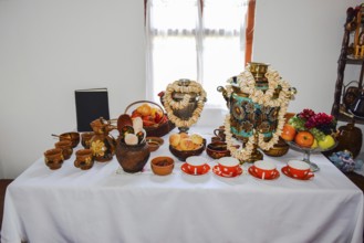 Set the table with utensils, plates and cups. Taman, Krasnodar Krai, Russia