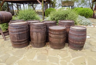 Stacked wine barrels. Decoration of the barrels in the village Ataman. Taman, Krasnodar Krai,