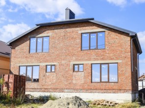 Two-storey house made of red brick. Atyrau, Kazakhstan