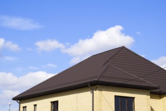 Decorative metal tile on a roof. Atyrau, Kazakhstan