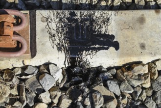 Black Resin shed on the railroad ties. Atyrau, Kazakhstan