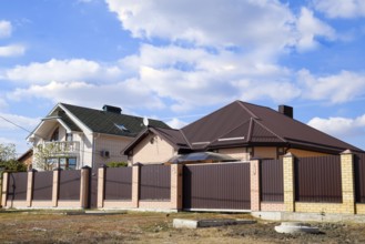 Decorative metal on the roof of a brick house. Atyrau, Kazakhstan