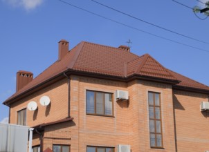 Decorative metal tile on a roof. Atyrau, Kazakhstan