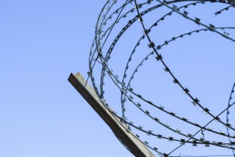 Barbed wire on the fence. Atyrau, Kazakhstan