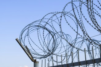Barbed wire on the fence. Atyrau, Kazakhstan