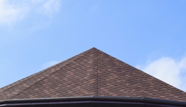 Decorative metal tile on a roof. Atyrau, Kazakhstan
