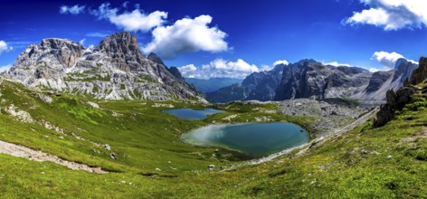 Alpine Landscape With Mountain Peaks And Clear Lakes At The Formation Tre Cime Di Lavaredo In The