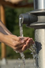 Catching Fresh And Cool Water And Cleaning Hands In An Artificial Spring, Austria