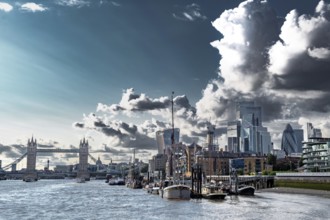 Tower Bridge And River Thames With Ships And Boats In Front Of Modern Office Buildings In The City