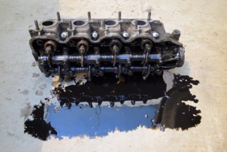 The head of the block of cylinders removed from the engine for repair. Atyrau, Kazakhstan