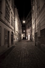 Narrow Alley With Streetlights And Cobblestones In The Inner City Of Vienna In Austria