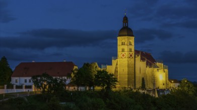 The pilgrimage church of the Assumption of the Virgin Mary on the Bogenberg has a golden light in