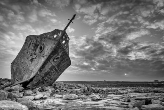 Dramatic b&w of Old Plassey shipwreck on shore in aran island Inisheer. Ireland