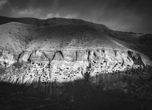 Black and white dramatic landscape of Vardzia, cave city. Georgia. Unique and mysterious places in