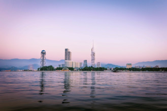 Iveria beach waterfront view with famous Batumi landmarks in the background: Chacha tower, Ferris