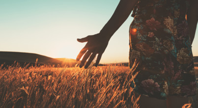Tranquil Meadow during sunrise with girl in dress. Fields by David Gareji monastery complex