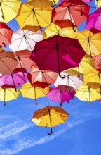 Colorful Umbrellas Hanging As Street Decoration And Sun Protection In The City Of Bordeaux, France