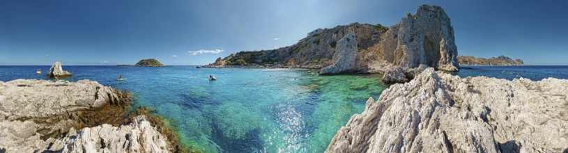 Panorama of the picturesque Grande Blue coastline with clear blue waters and the majestic cave of