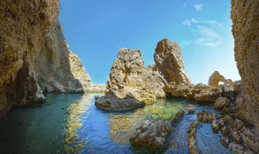 Cave of Archangelos with crystal clear water and sunny sky, Cave of Archangelos, Grande Blue Beach,