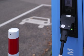 Car park with petrol pump, EnBW charging station for electric cars, electric filling station,