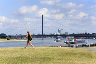 Rhine promenade, boat trip on the Rhine, view of Oberkassel bridge, Düsseldorf, Rhineland, North