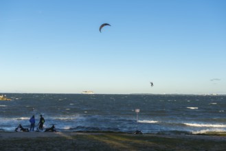 Kitesurfing in the Bay of Kiel in strong winds, high swell, Big Air Jump, Strande near Kiel,