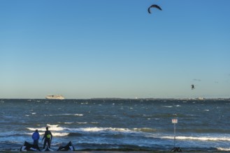 Kitesurfing in the Bay of Kiel in strong winds, high swell, Big Air Jump, Strande near Kiel,