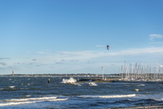 Kitesurfing in the Bay of Kiel in strong winds, high swell, Strande near Kiel,