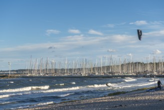 Kitesurfing in the Bay of Kiel in strong winds, high swell, Strande near Kiel,