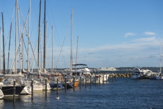 Strande marina near Kiel, Rendsburg-Eckernförde district, AIDA, ship masts, dolphins, Baltic Sea,