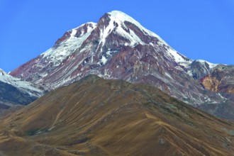 The snow and ice-covered peak of Kazbek, Stepantsminda, Georgia