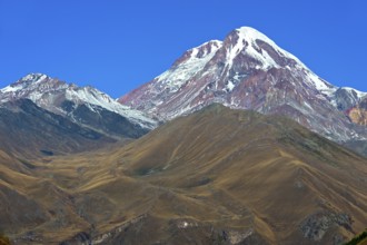 The snow and ice-covered peak of Kazbek, Stepantsminda, Georgia