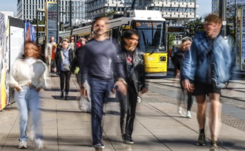 A long exposure shows people at a tram stop at Alexanderplatz, Berlin, 27/09/2025, Berlin, Berlin,