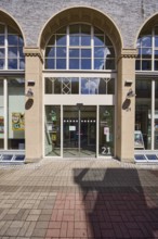 Townhouse, pedestrian zone, building, facade with windows, entrance area, citizens' office, city