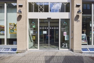 Townhouse, pedestrian zone, building, facade with windows, entrance area, citizens' office, city