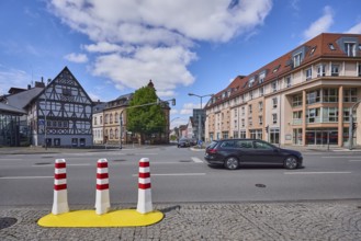 Half-timbered house, general architecture, traffic light crossing, bollards, pavement made of