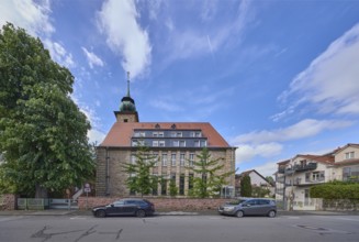 Chapel of the mother house St. Vinzent, general architecture, car park with vehicles, trees, blue