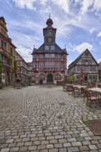 Historic town hall, old town, square, half-timbered houses, tower clock, cobblestone pavement,