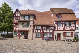 Old town, historic half-timbered houses, building, pointed roof with red roof tiles, tree,