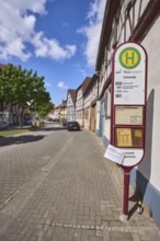 Bus stop Lehrstraße, half-timbered houses, general architecture, street, trees, car park with