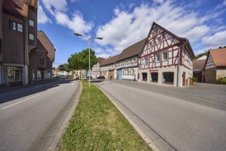 Half-timbered houses, general architecture, lantern, central reservation, trees, lawn, lanes, blue