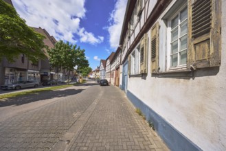 Historic half-timbered houses, general architecture, street, car park with vehicles, facade with
