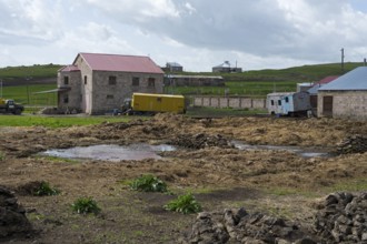 Rural scene with some buildings and caravans in a cloudy environment, Rya Taza, Ria Taza,