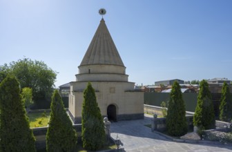 Temple with cone-shaped roof surrounded by a well-tended garden, Yazidi temple, Yazidi temple,