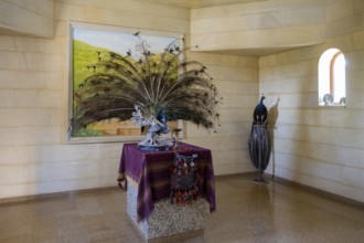 Interior view with peacock sculpture and colourful cloth on table, Yazidi temple, Yazidi temple,
