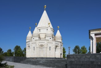 White temple with towers and domes under a clear blue sky, Yazidi temple, Yazidi temple, the