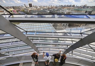 Interior view of the Reichstag dome with visitors on the ramp and view of the cityscape, Reichstag